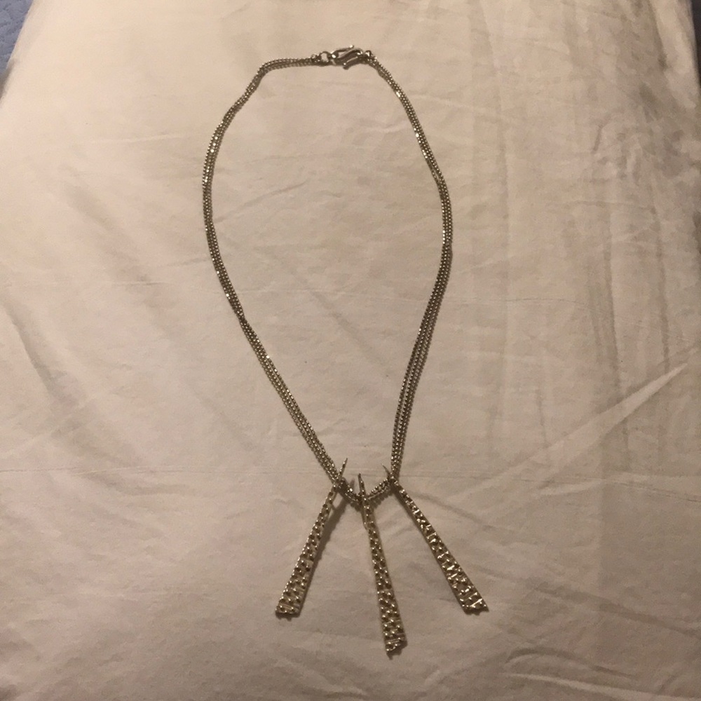 Silver tone triple strand necklace.